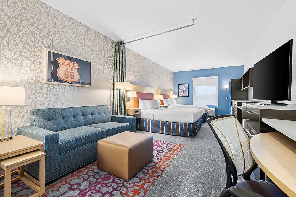 King guestroom featuring sleek furnishings, ambient lighting, and modern design touches