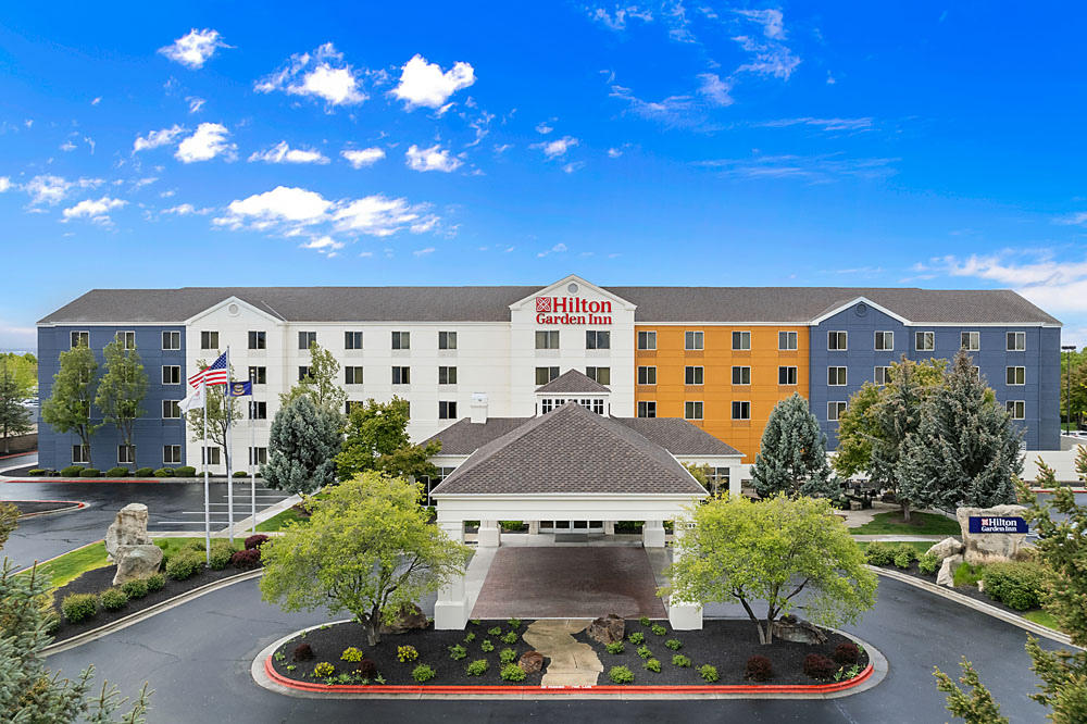 Aerial daytime view of Hilton Garden Inn Boise Spectrum with Boise city surroundings.