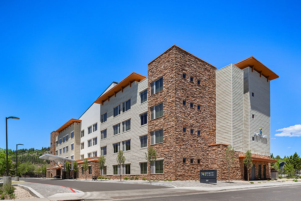 Hyatt Place Flagstaff exterior during daylight with clear blue skies